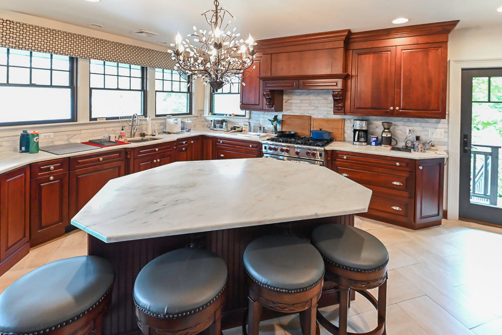 Custom Traditional Dark Wooden Kitchen with Marble Countertops and Wolf Appliances