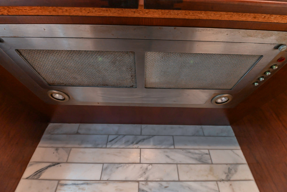 Custom Traditional Dark Wooden Kitchen with Marble Countertops and Wolf Appliances