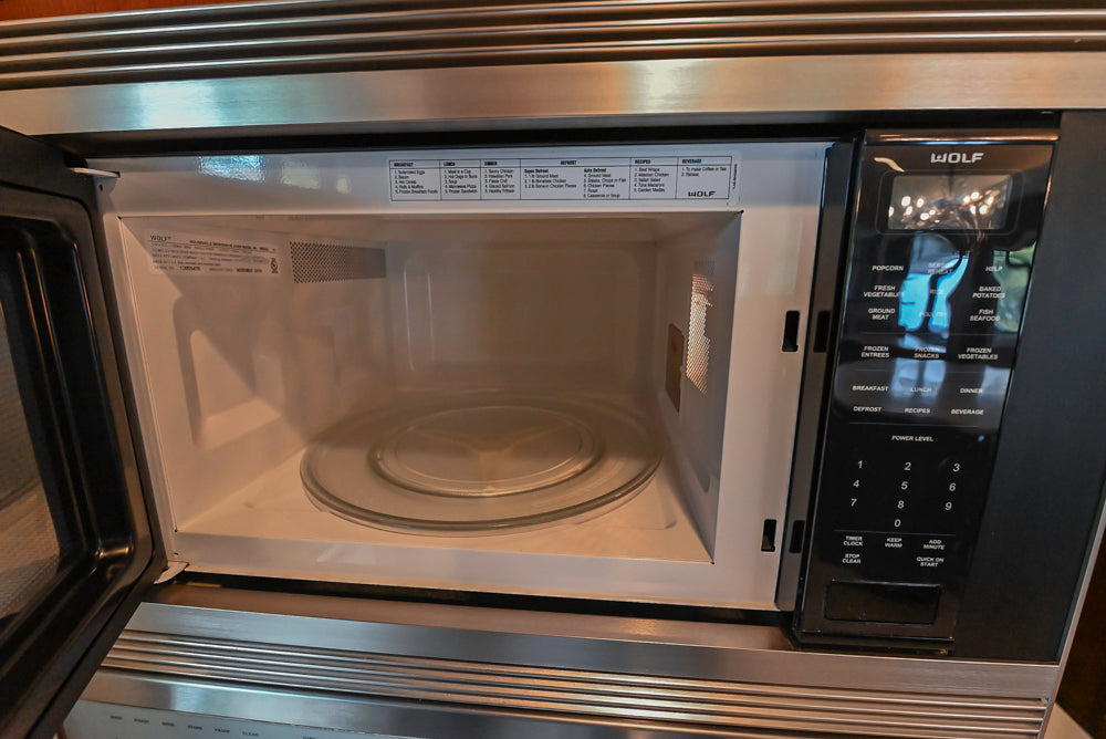 Custom Traditional Dark Wooden Kitchen with Marble Countertops and Wolf Appliances