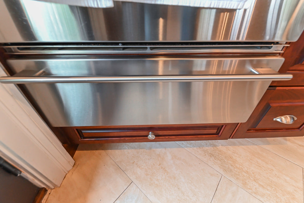 Custom Traditional Dark Wooden Kitchen with Marble Countertops and Wolf Appliances