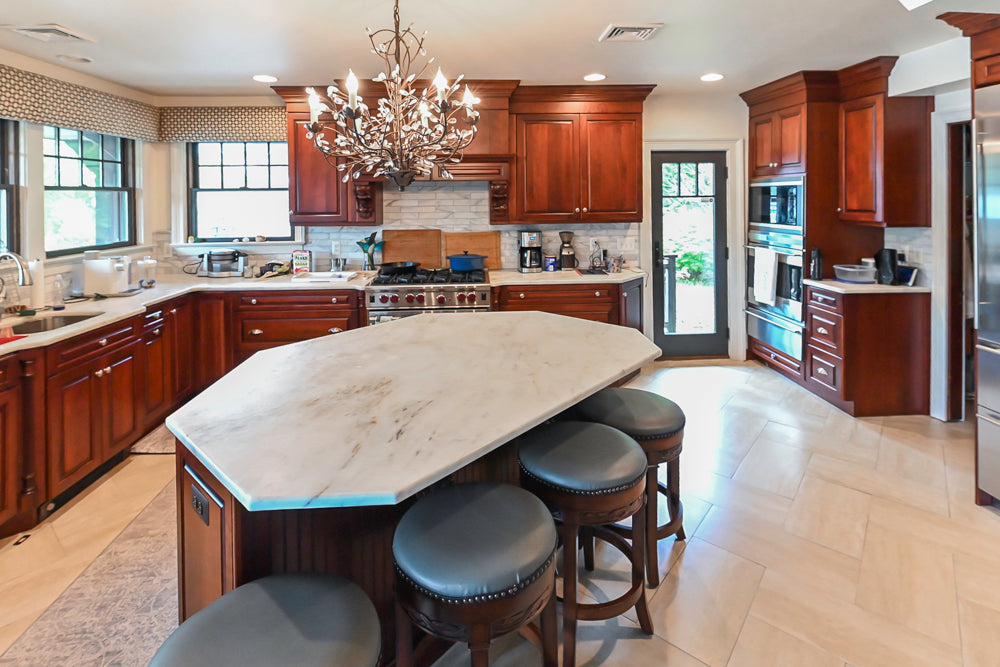 Custom Traditional Dark Wooden Kitchen with Marble Countertops and Wolf Appliances