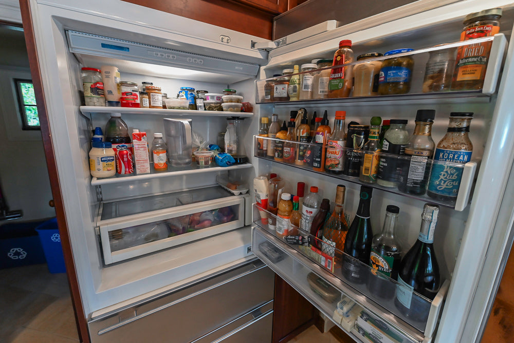 Custom Traditional Dark Wooden Kitchen with Marble Countertops and Wolf Appliances