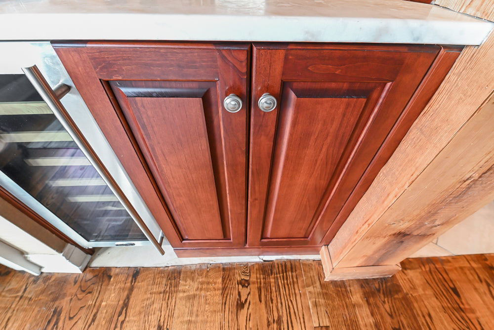Custom Traditional Dark Wooden Kitchen with Marble Countertops and Wolf Appliances