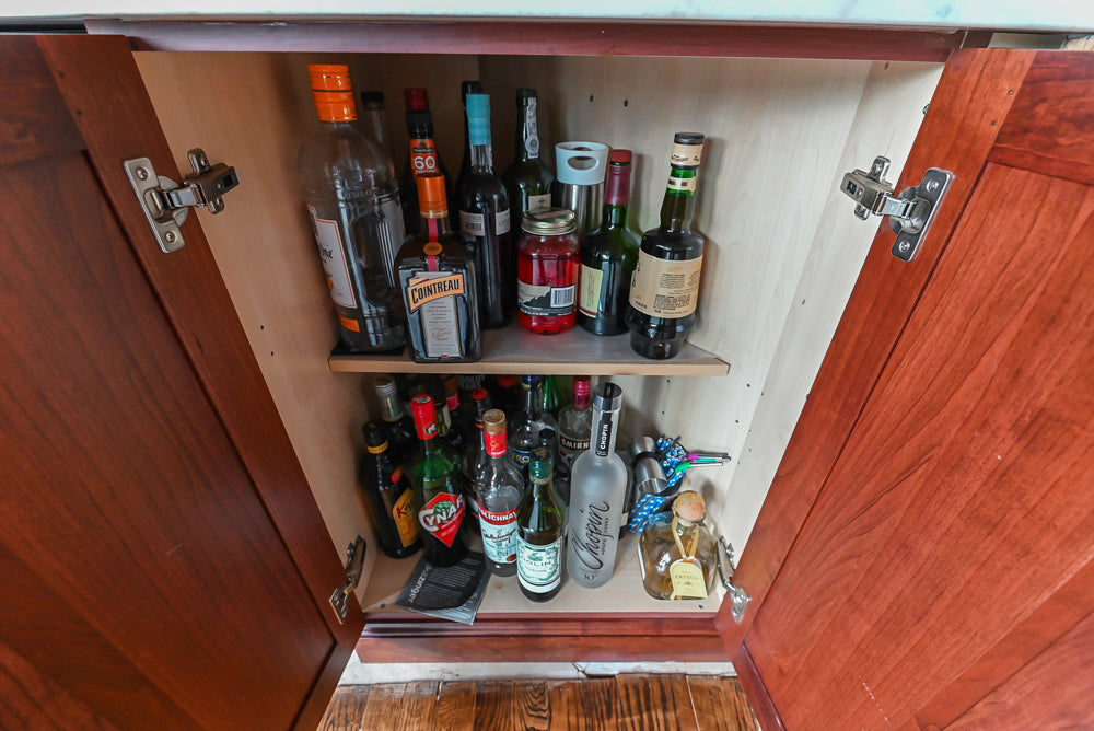 Custom Traditional Dark Wooden Kitchen with Marble Countertops and Wolf Appliances