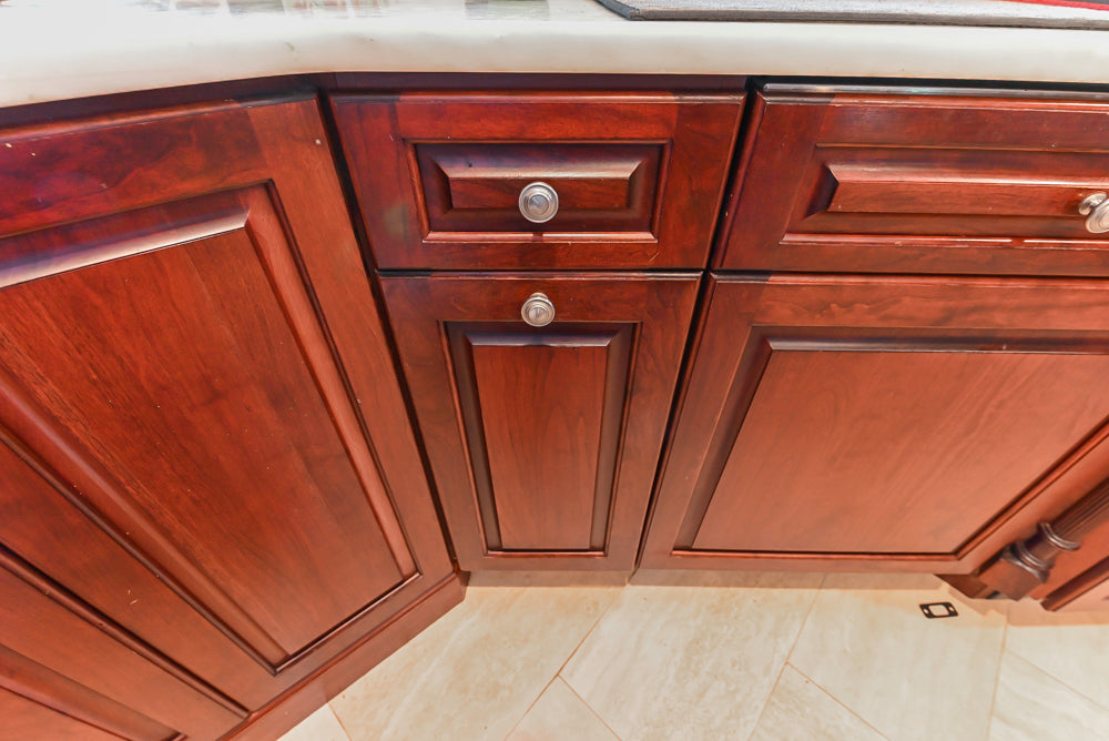 Custom Traditional Dark Wooden Kitchen with Marble Countertops and Wolf Appliances