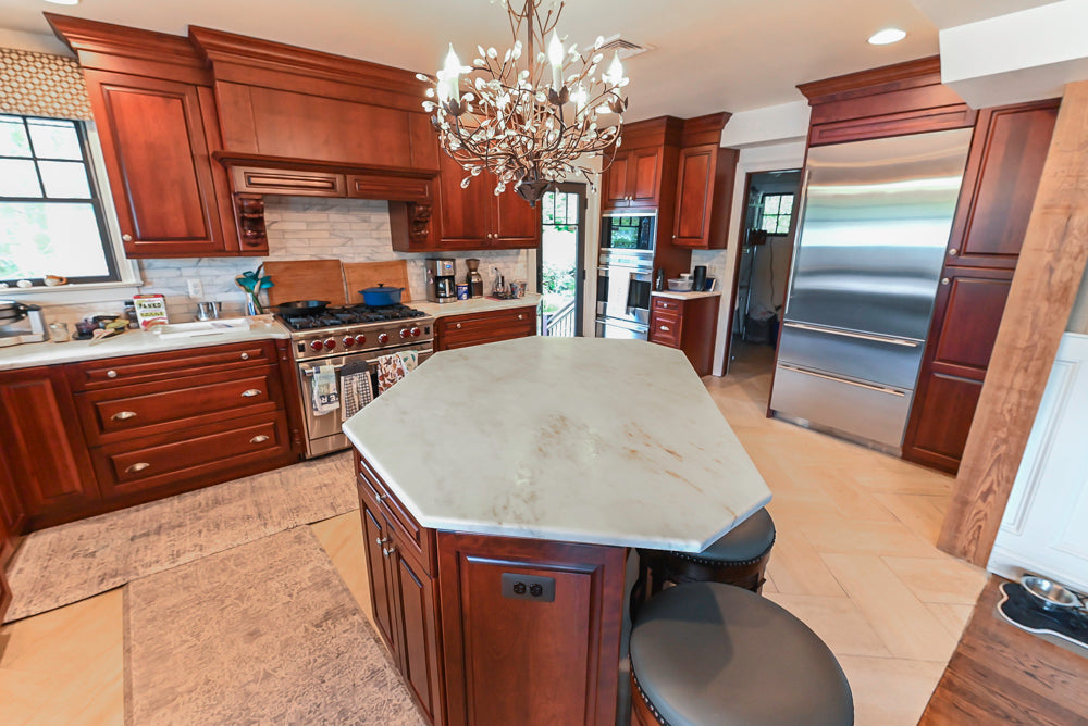 Custom Traditional Dark Wooden Kitchen with Marble Countertops and Wolf Appliances