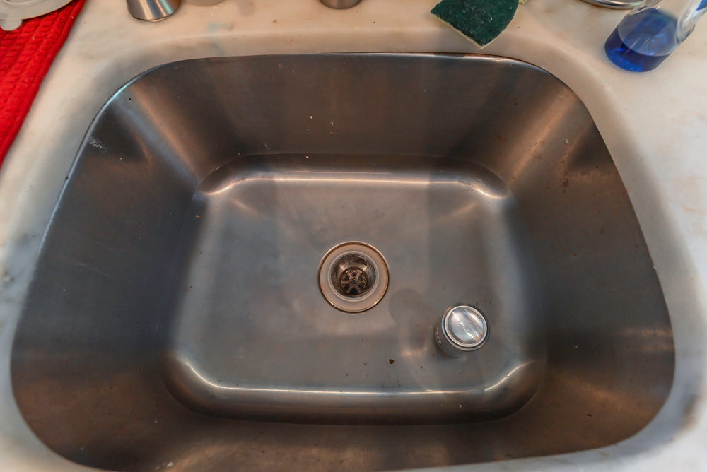 Custom Traditional Dark Wooden Kitchen with Marble Countertops and Wolf Appliances