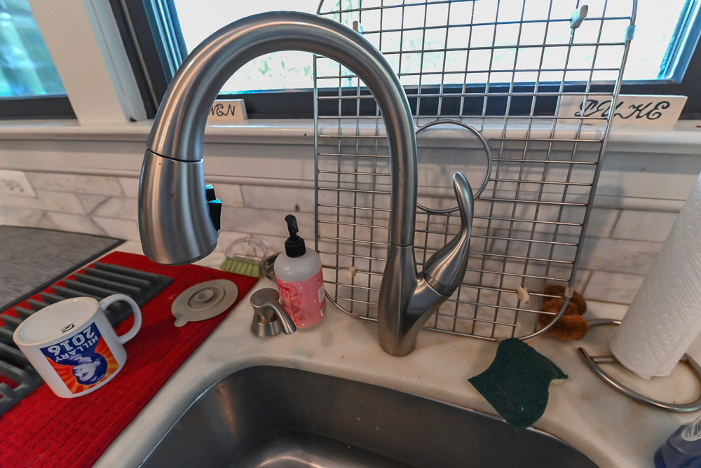 Custom Traditional Dark Wooden Kitchen with Marble Countertops and Wolf Appliances