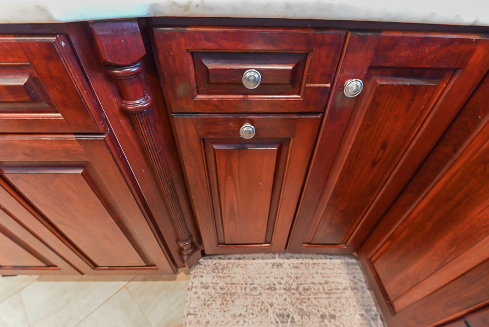 Custom Traditional Dark Wooden Kitchen with Marble Countertops and Wolf Appliances