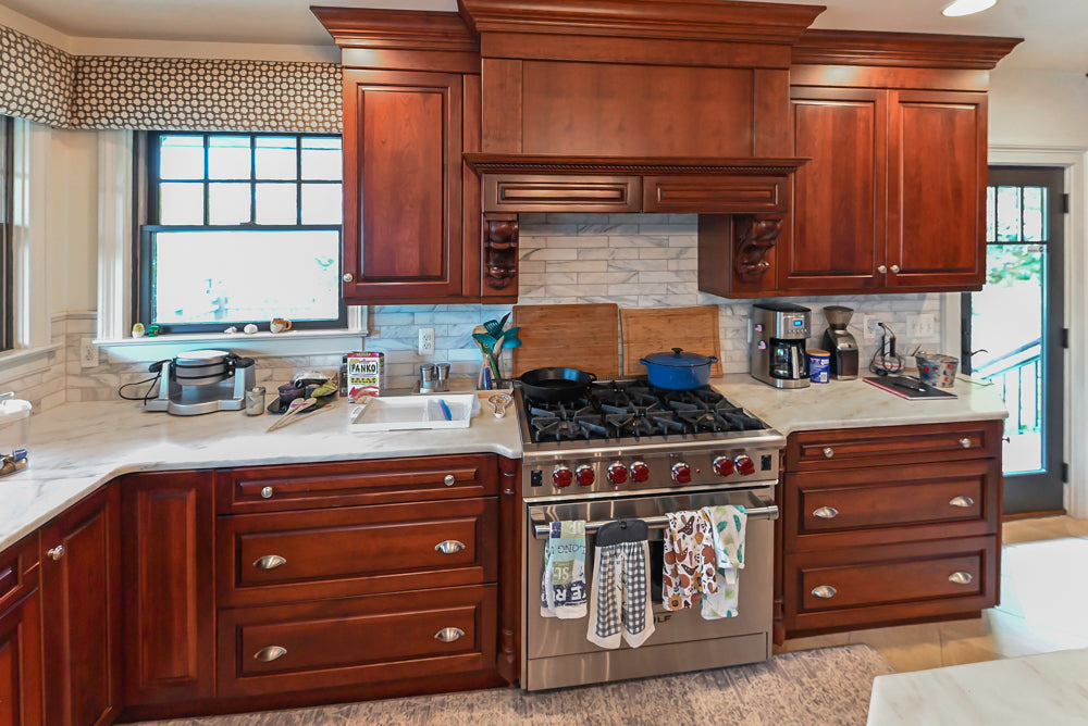 Custom Traditional Dark Wooden Kitchen with Marble Countertops and Wolf Appliances