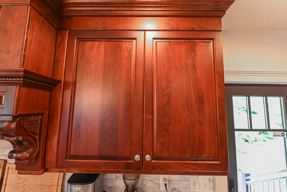 Custom Traditional Dark Wooden Kitchen with Marble Countertops and Wolf Appliances