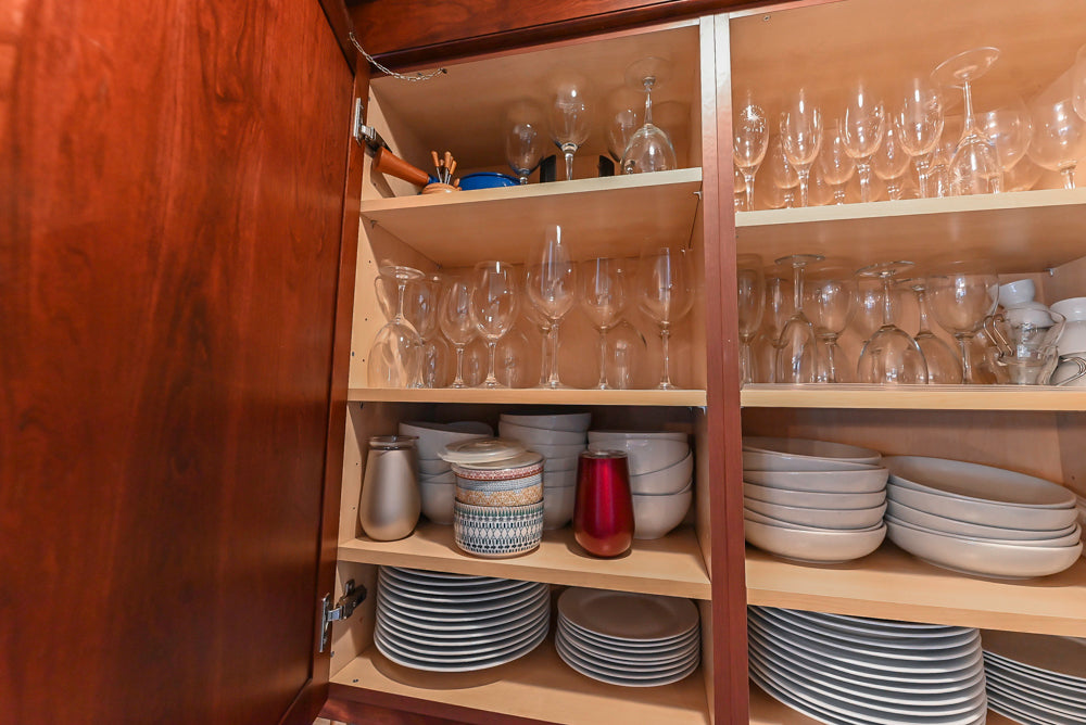 Custom Traditional Dark Wooden Kitchen with Marble Countertops and Wolf Appliances