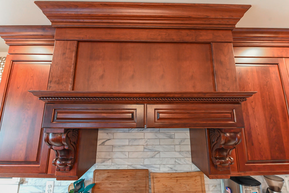 Custom Traditional Dark Wooden Kitchen with Marble Countertops and Wolf Appliances