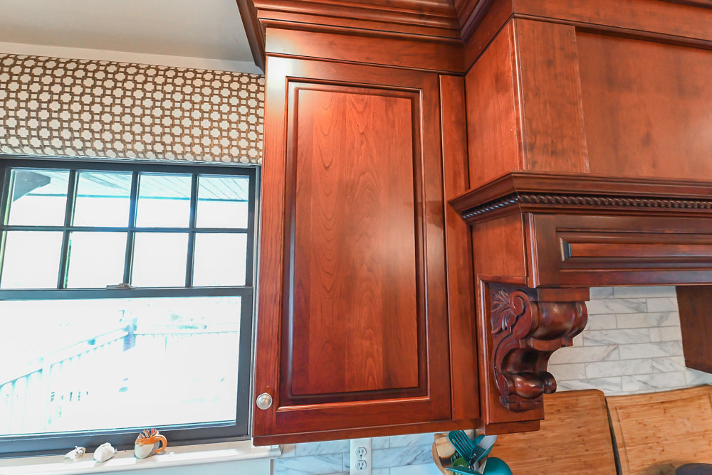 Custom Traditional Dark Wooden Kitchen with Marble Countertops and Wolf Appliances