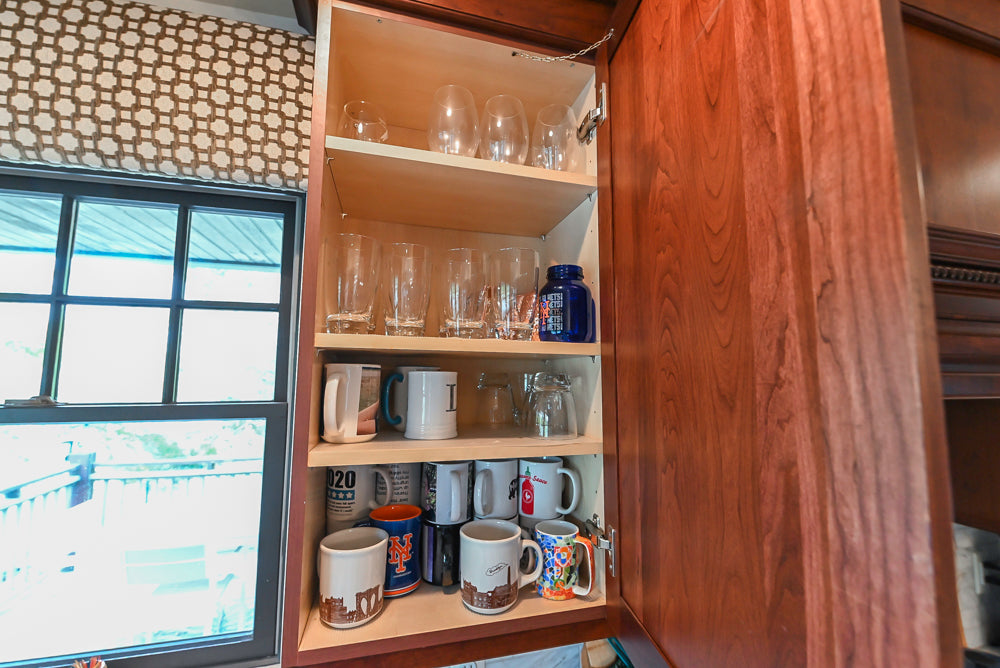 Custom Traditional Dark Wooden Kitchen with Marble Countertops and Wolf Appliances