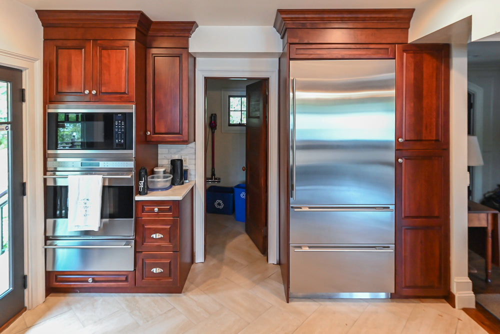 Custom Traditional Dark Wooden Kitchen with Marble Countertops and Wolf Appliances