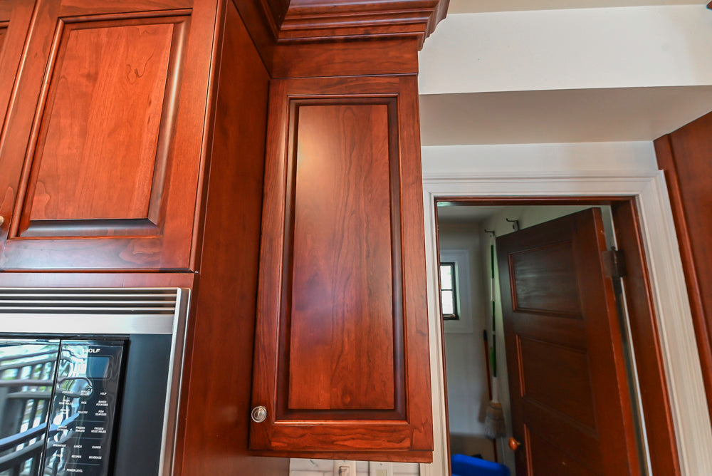 Custom Traditional Dark Wooden Kitchen with Marble Countertops and Wolf Appliances