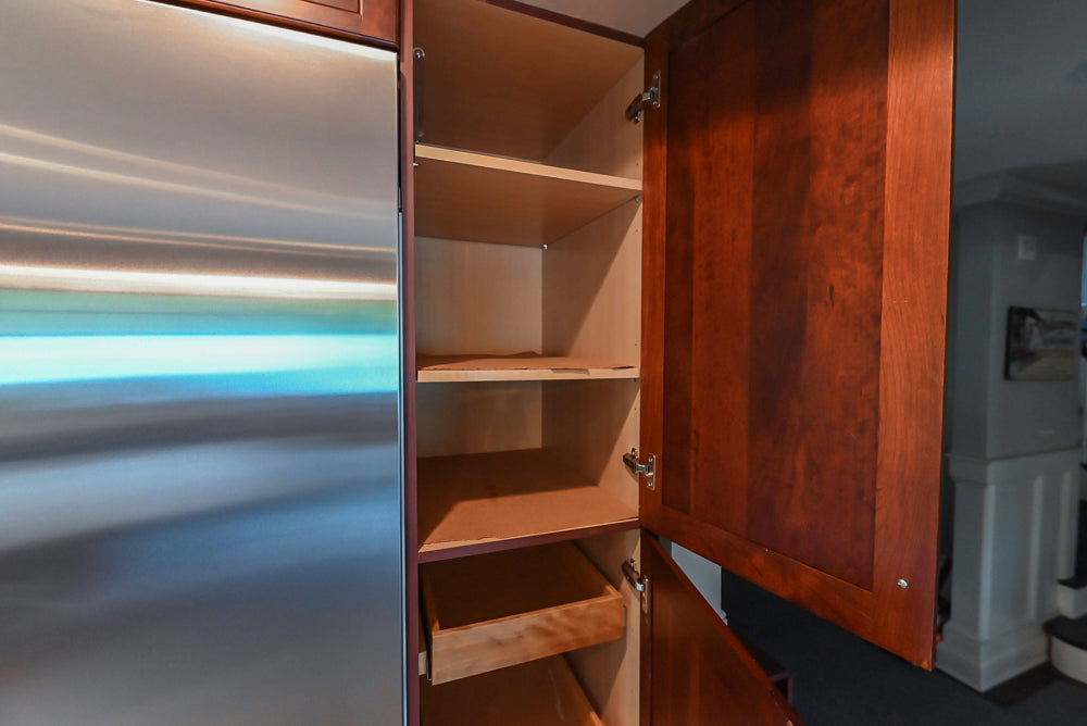 Custom Traditional Dark Wooden Kitchen with Marble Countertops and Wolf Appliances