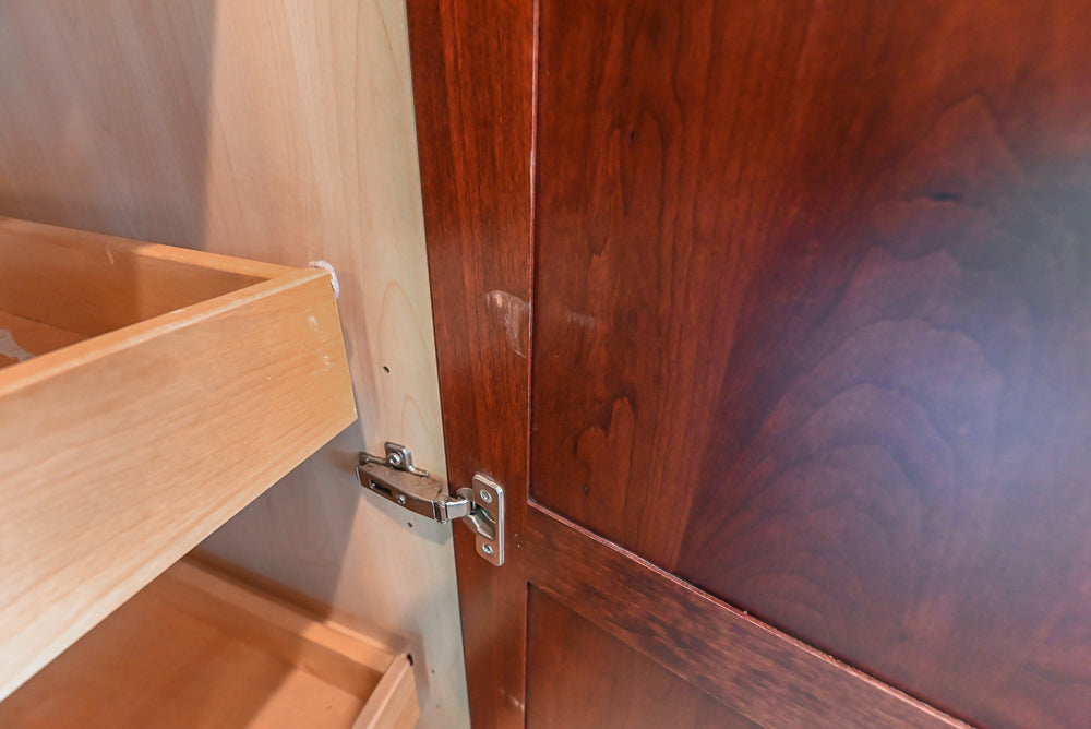 Custom Traditional Dark Wooden Kitchen with Marble Countertops and Wolf Appliances