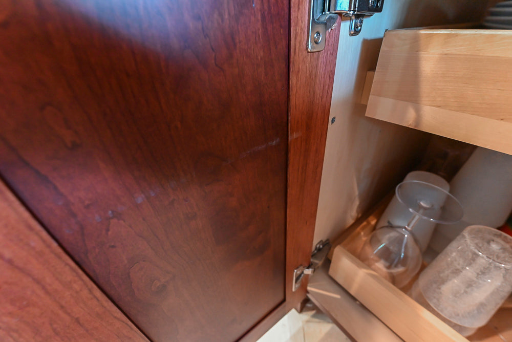 Custom Traditional Dark Wooden Kitchen with Marble Countertops and Wolf Appliances