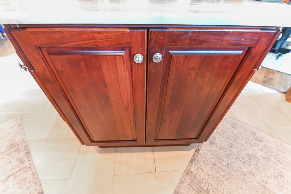 Custom Traditional Dark Wooden Kitchen with Marble Countertops and Wolf Appliances
