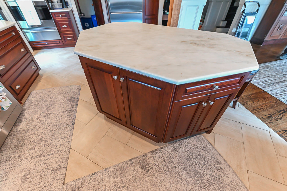 Custom Traditional Dark Wooden Kitchen with Marble Countertops and Wolf Appliances