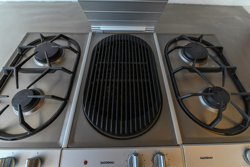 Poggenpohl Modern Light Wood Veneer Kitchen with White Marble Countertops and Appliances