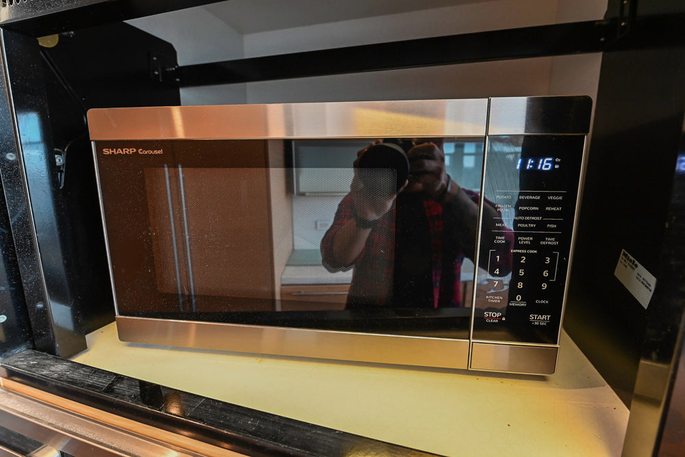 Poggenpohl Modern Light Wood Veneer Kitchen with White Marble Countertops and Appliances