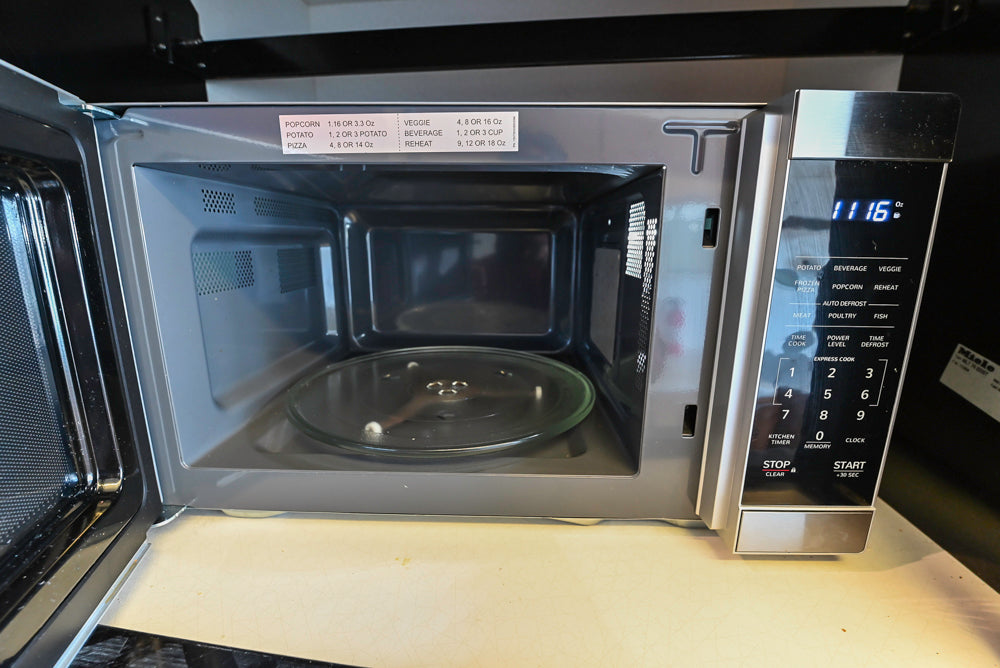 Poggenpohl Modern Light Wood Veneer Kitchen with White Marble Countertops and Appliances