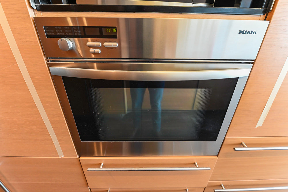 Poggenpohl Modern Light Wood Veneer Kitchen with White Marble Countertops and Appliances