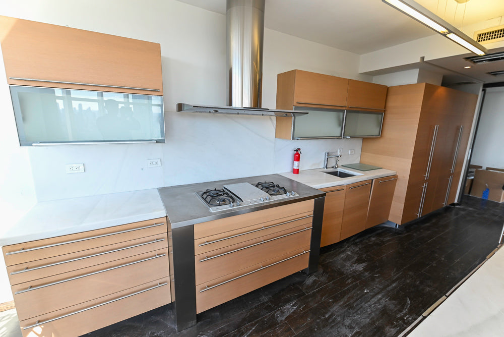 Poggenpohl Modern Light Wood Veneer Kitchen with White Marble Countertops and Appliances