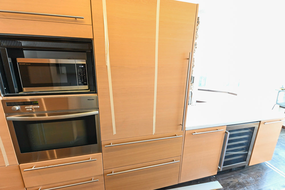 Poggenpohl Modern Light Wood Veneer Kitchen with White Marble Countertops and Appliances