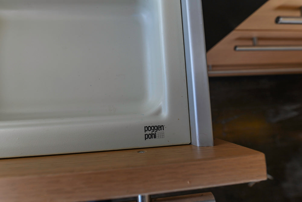 Poggenpohl Modern Light Wood Veneer Kitchen with White Marble Countertops and Appliances