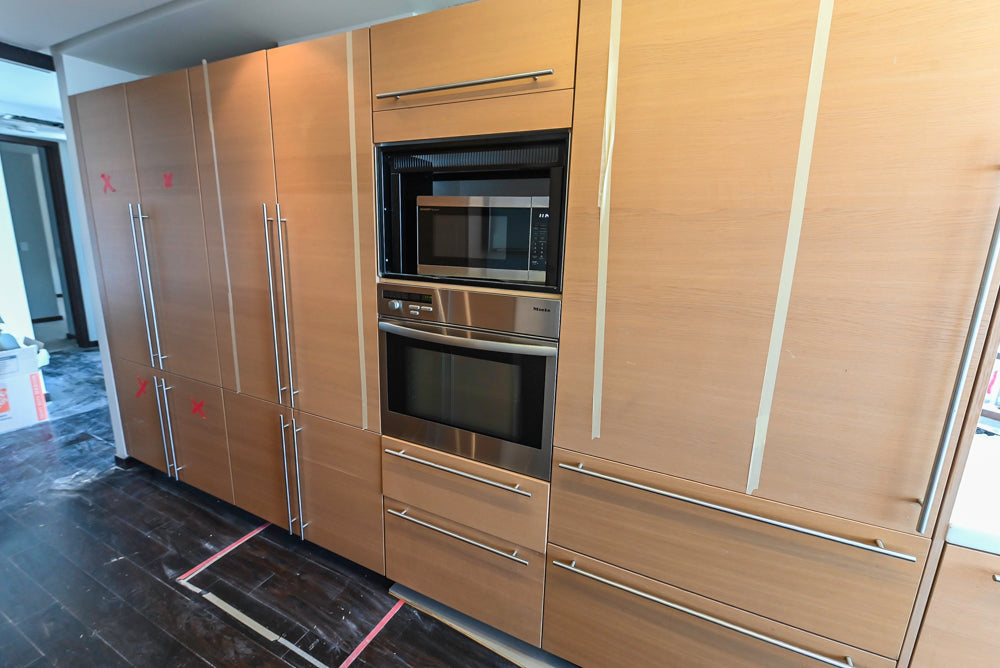 Poggenpohl Modern Light Wood Veneer Kitchen with White Marble Countertops and Appliances