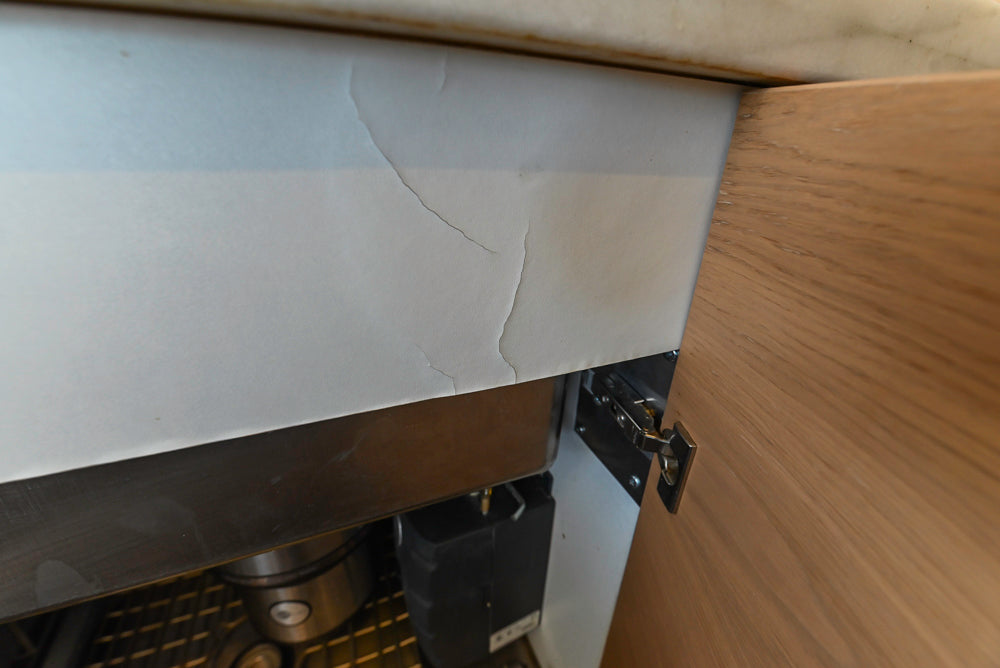 Poggenpohl Modern Light Wood Veneer Kitchen with White Marble Countertops and Appliances