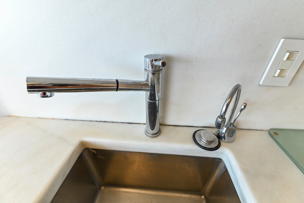 Poggenpohl Modern Light Wood Veneer Kitchen with White Marble Countertops and Appliances