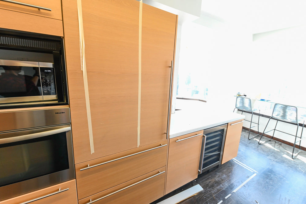 Poggenpohl Modern Light Wood Veneer Kitchen with White Marble Countertops and Appliances