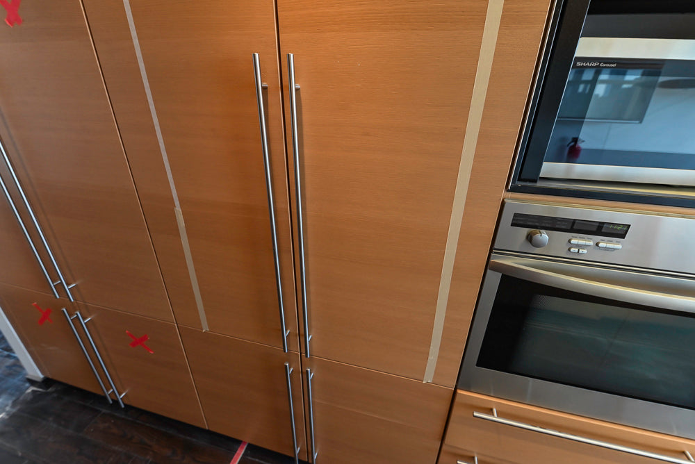 Poggenpohl Modern Light Wood Veneer Kitchen with White Marble Countertops and Appliances