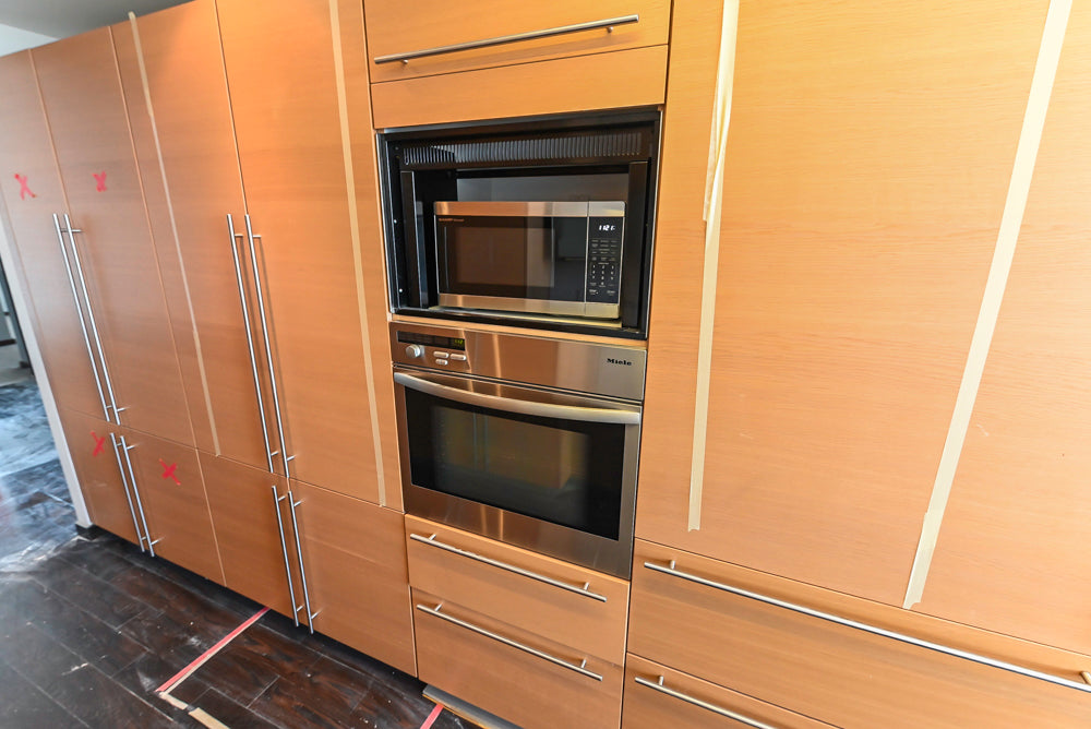 Poggenpohl Modern Light Wood Veneer Kitchen with White Marble Countertops and Appliances