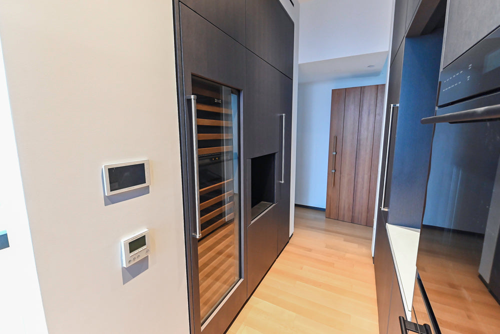 Custom Modern Wood Veneer Kitchen with White Marble Countertops and Wolf & Miele Appliances