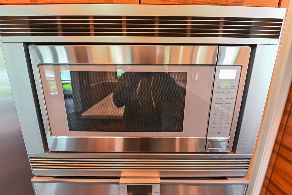 Custom Modern Tigerwood Kitchen with Marble Countertops and Gaggenau Appliances