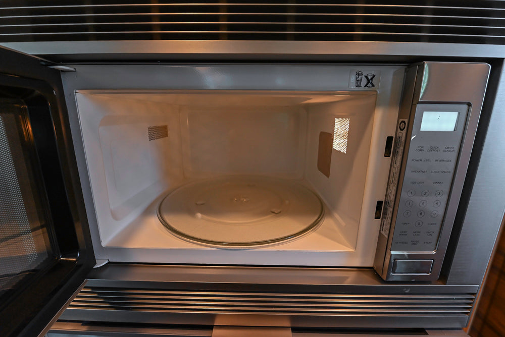 Custom Modern Tigerwood Kitchen with Marble Countertops and Gaggenau Appliances