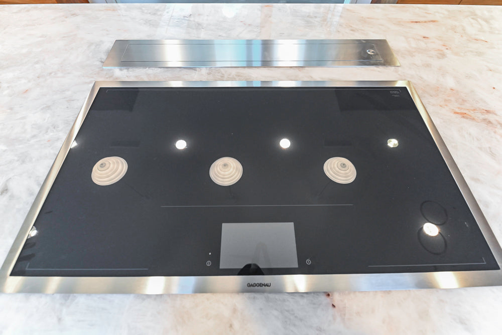 Custom Modern Tigerwood Kitchen with Marble Countertops and Gaggenau Appliances