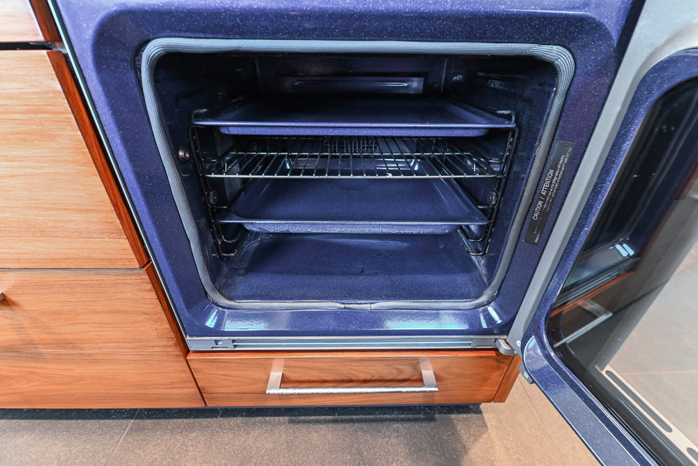 Custom Modern Tigerwood Kitchen with Marble Countertops and Gaggenau Appliances