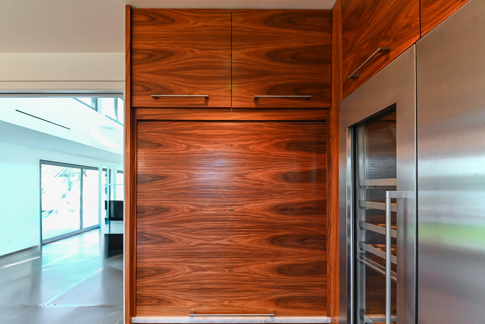 Custom Modern Tigerwood Kitchen with Marble Countertops and Gaggenau Appliances