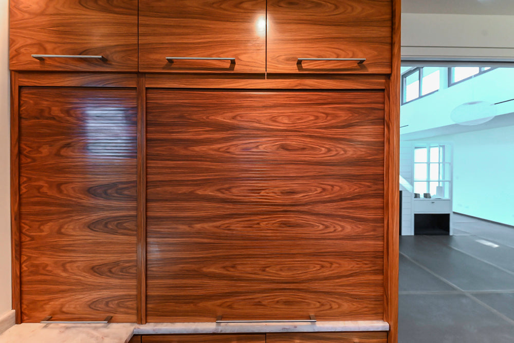 Custom Modern Tigerwood Kitchen with Marble Countertops and Gaggenau Appliances