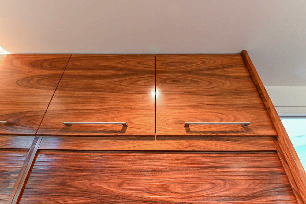 Custom Modern Tigerwood Kitchen with Marble Countertops and Gaggenau Appliances