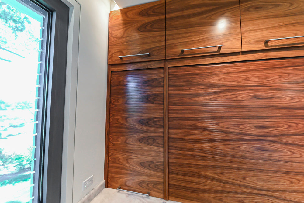 Custom Modern Tigerwood Kitchen with Marble Countertops and Gaggenau Appliances
