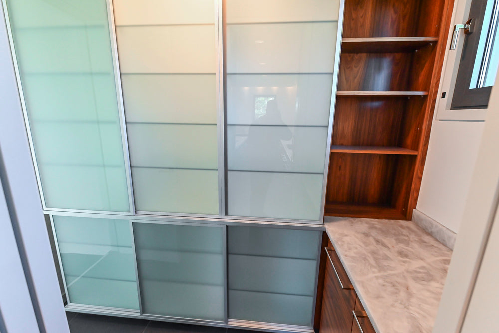 Custom Modern Tigerwood & Glass Paned Butler's Pantry with Marble Countertops