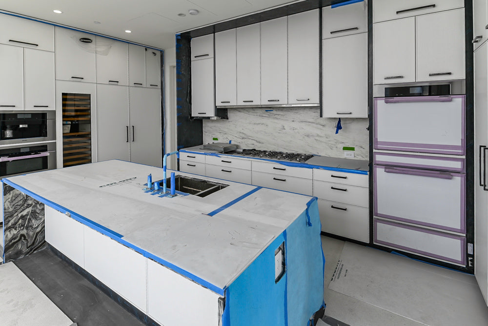 Custom Transitional White Kitchen with Island and Quartzite Countertops 